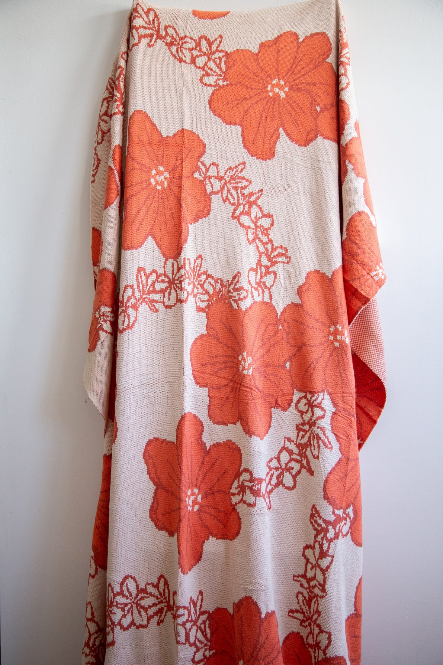 orange cotton throw blanket with floral print
