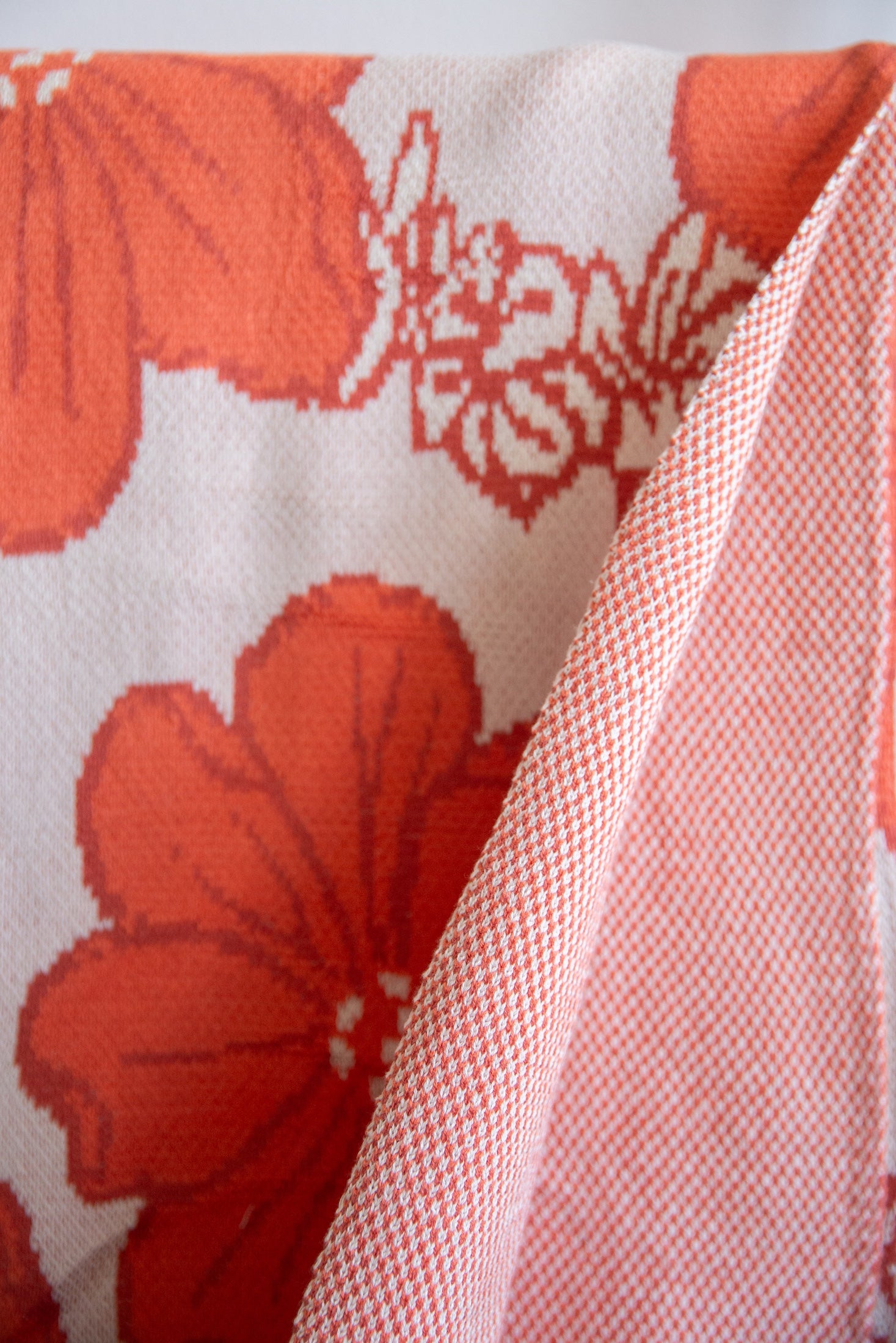 orange cotton throw blanket with floral print