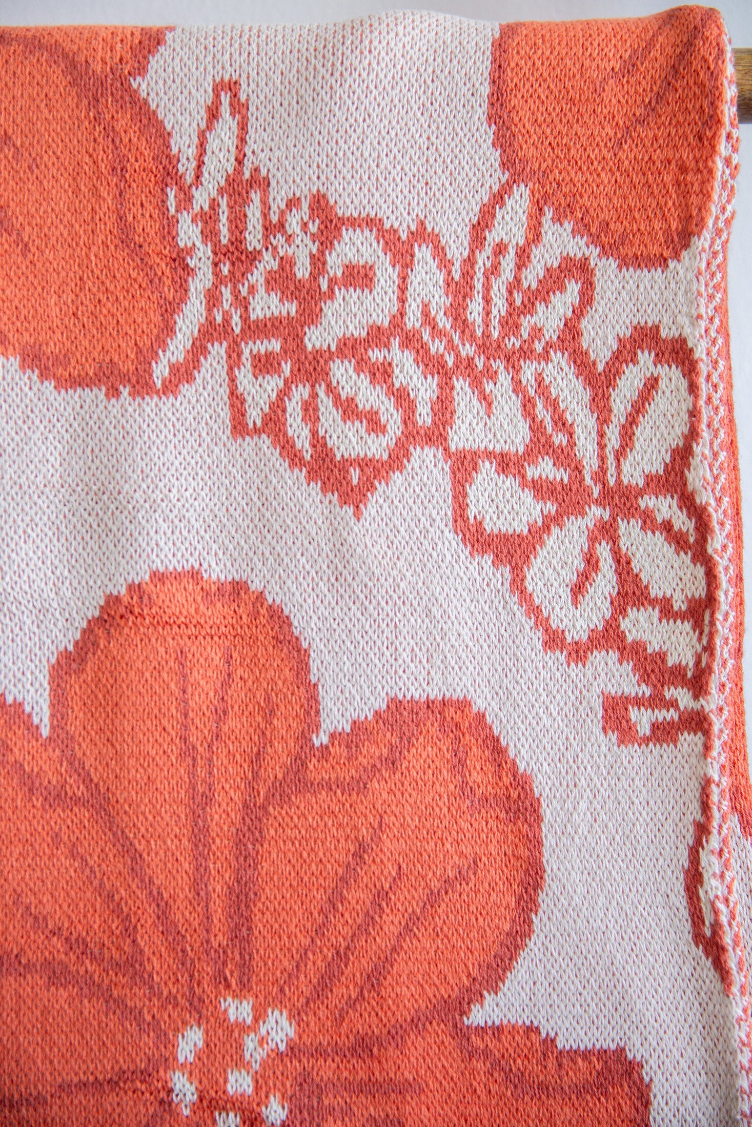 orange cotton throw blanket with floral print