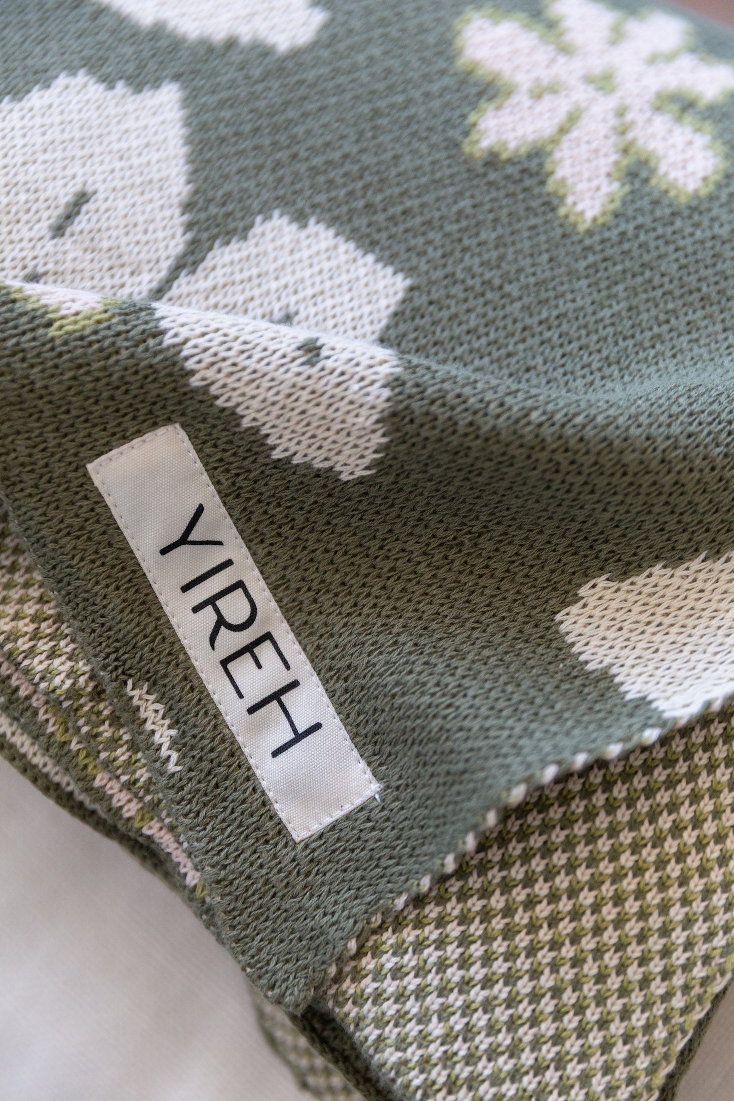 green cotton throw blanket with naupaka print