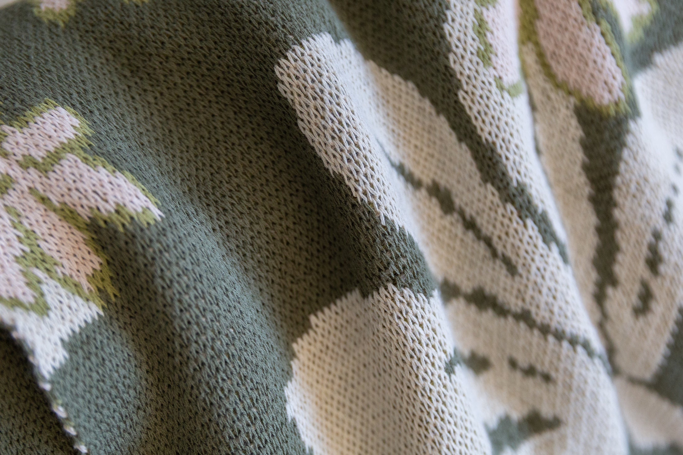 green cotton throw blanket with naupaka print
