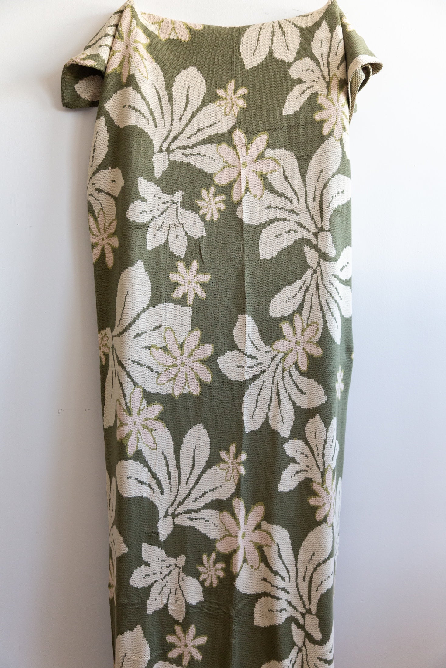 green cotton throw blanket with naupaka print
