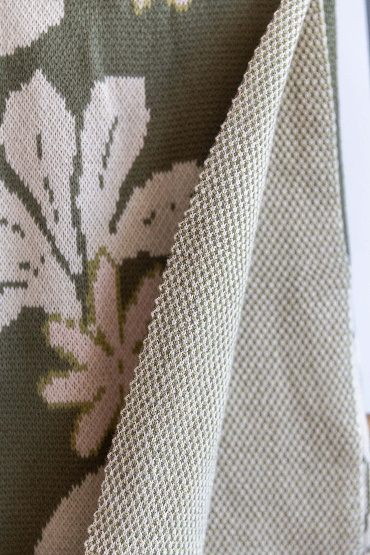 green cotton throw blanket with naupaka print