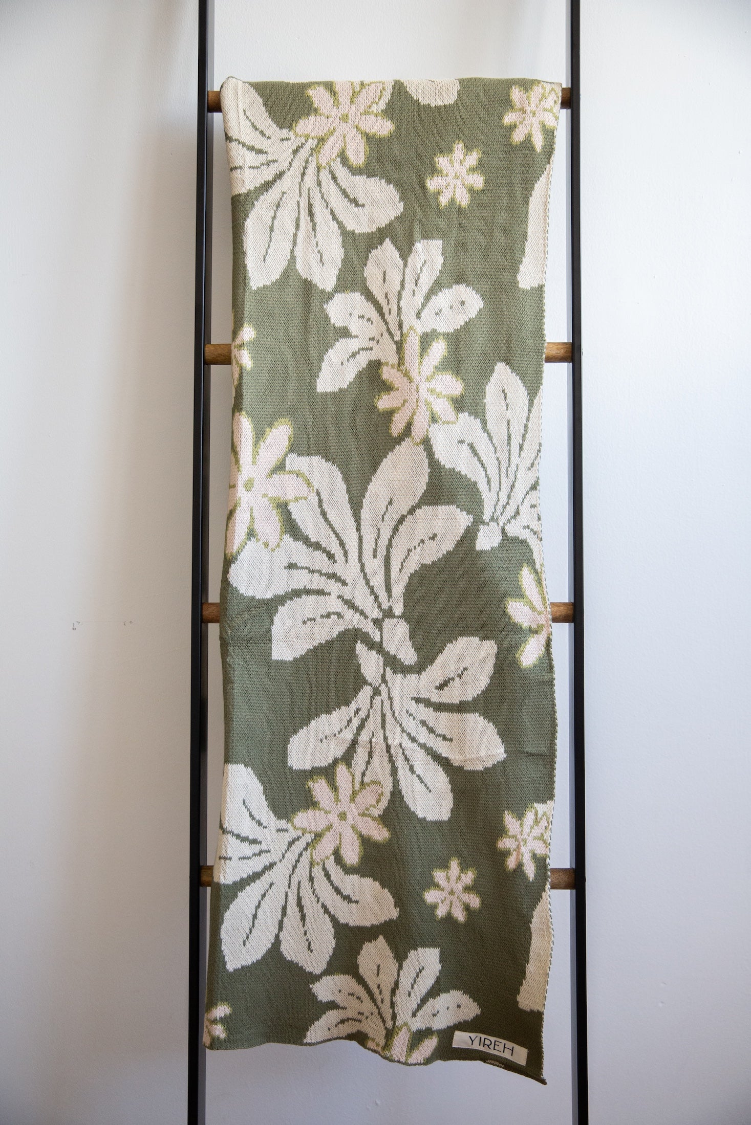 green cotton throw blanket with naupaka print