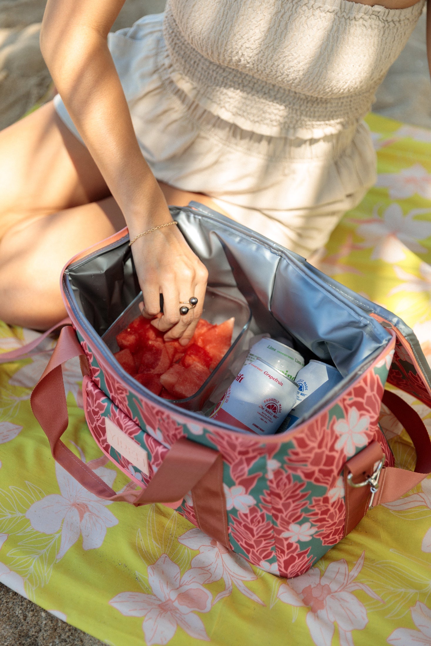 green cooler bag with tiare and red ginger floral pattern