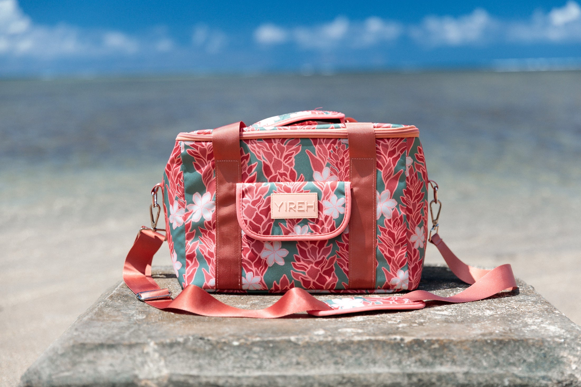 green cooler bag with tiare and red ginger floral pattern