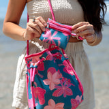 deep blue/teal neoprene drawstring crossbody purse with colorful floral pattern