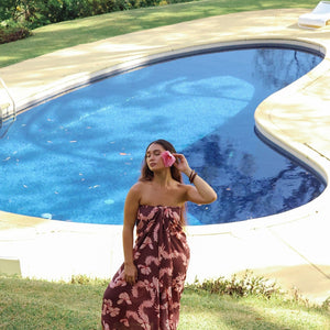 woman wearing pareo with awapuhi print
