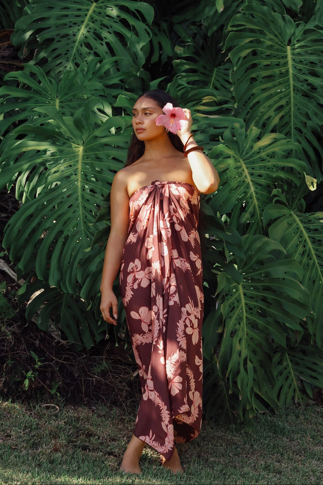 woman wearing pareo with awapuhi print