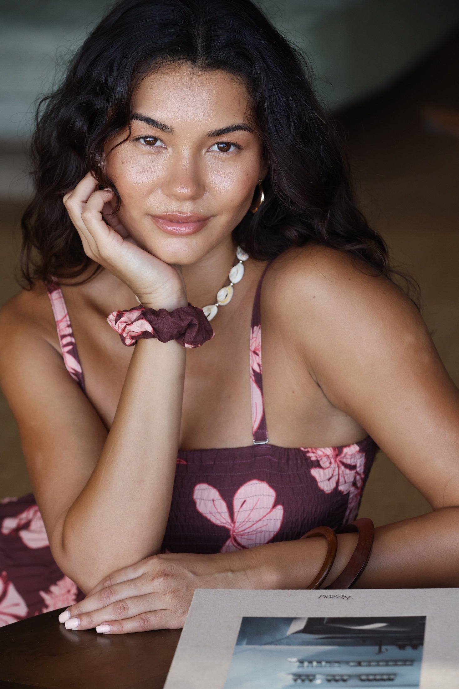 woman wearing mauve scrunchie with lei awapuhi print in hair
