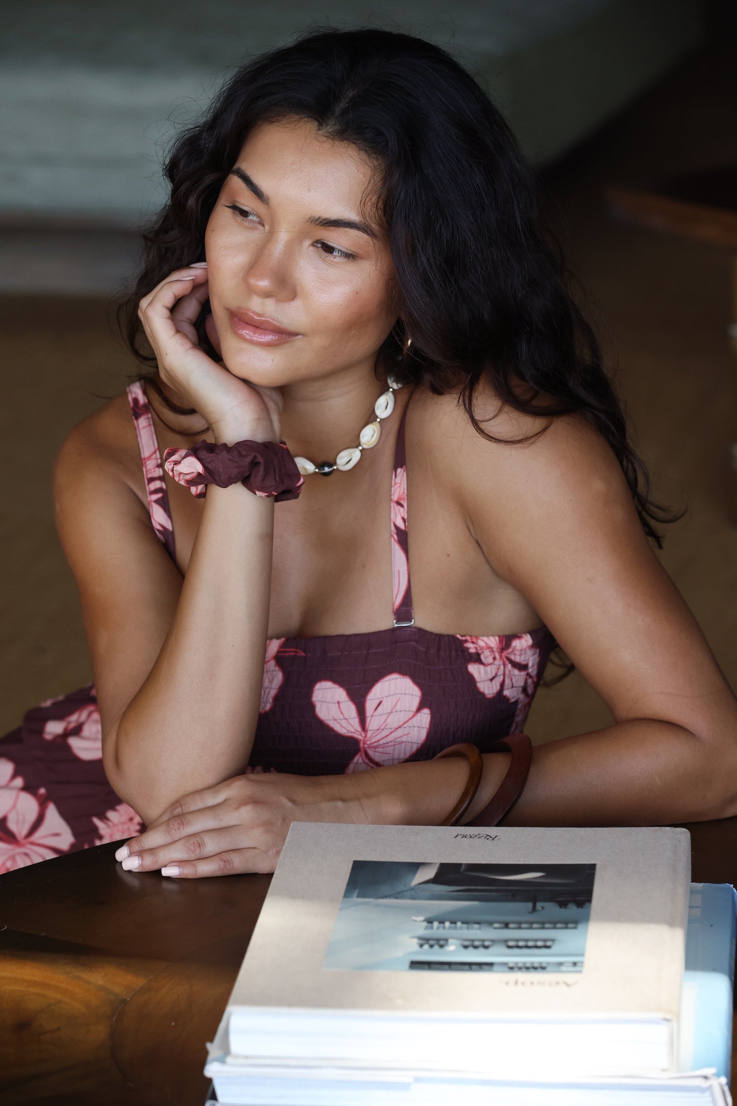 woman wearing mauve scrunchie with lei awapuhi print in hair