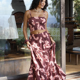 woman wearing brown bandeau with light pink lei awapuhi print