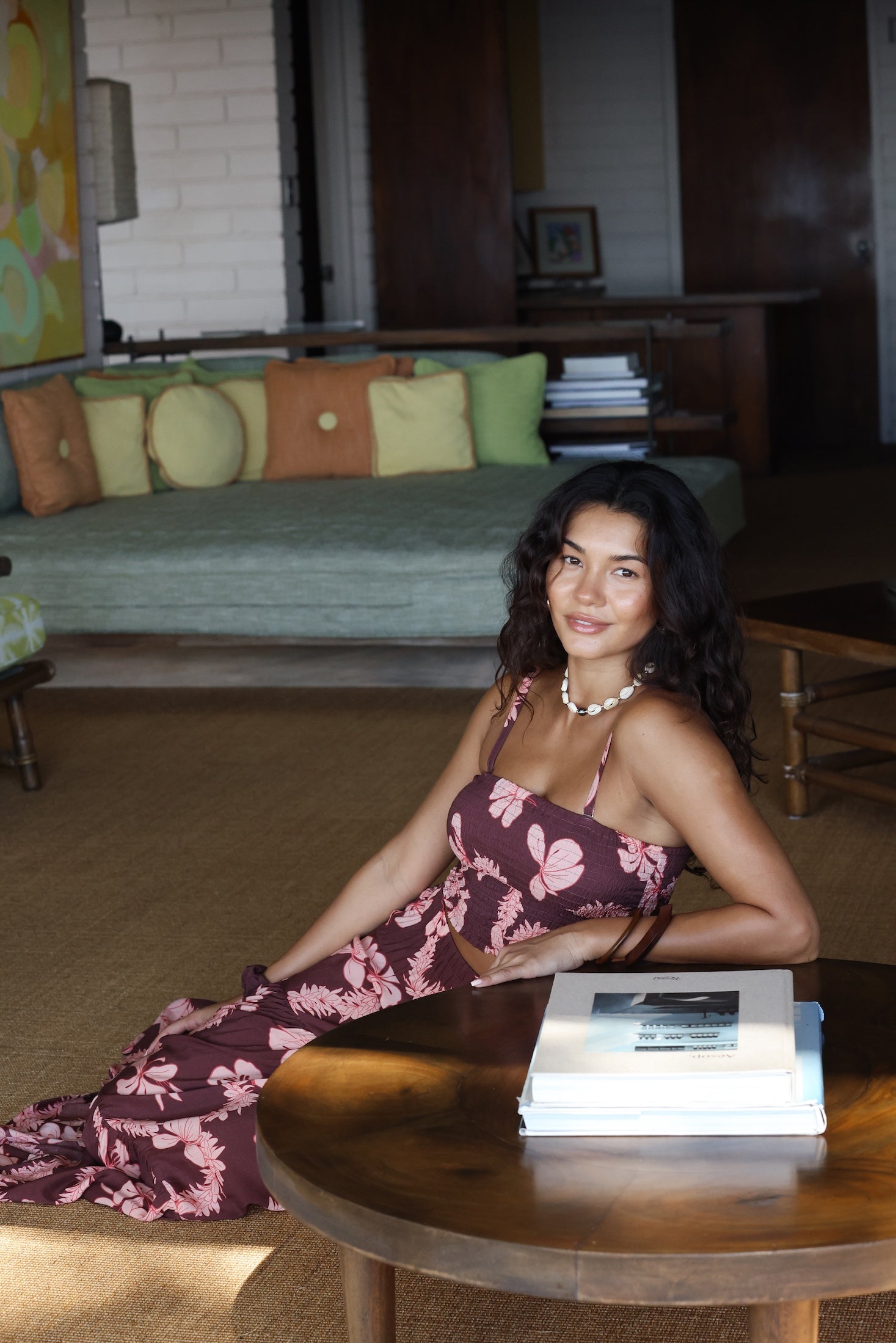 woman wearing brown bandeau with light pink lei awapuhi print