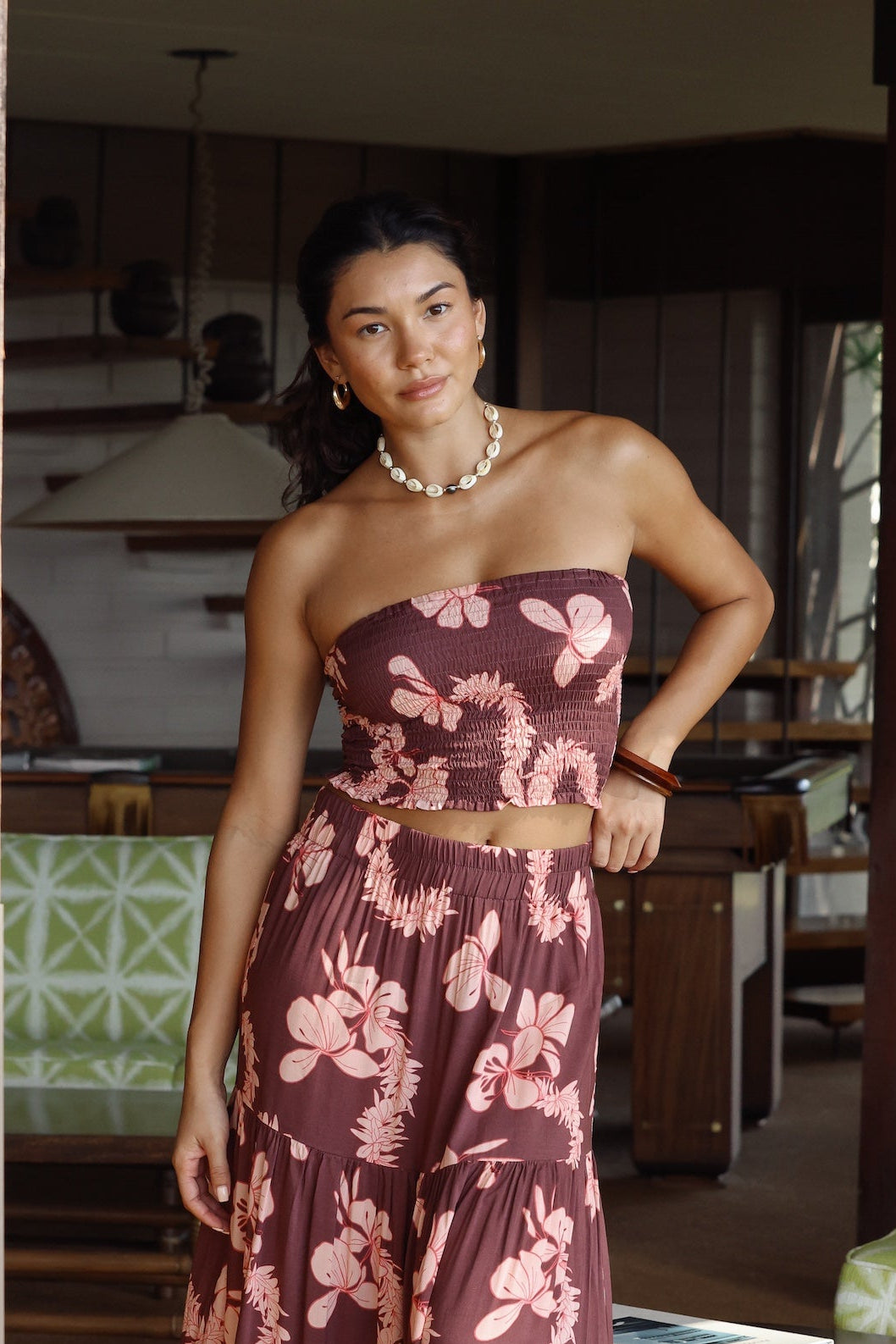 woman wearing brown bandeau with light pink lei awapuhi print