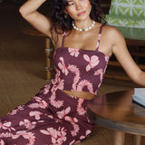 woman wearing brown bandeau with light pink lei awapuhi print