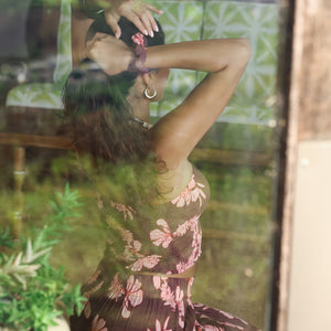woman wearing mauve scrunchie with lei awapuhi print in hair