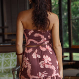 woman wearing brown bandeau with light pink lei awapuhi print