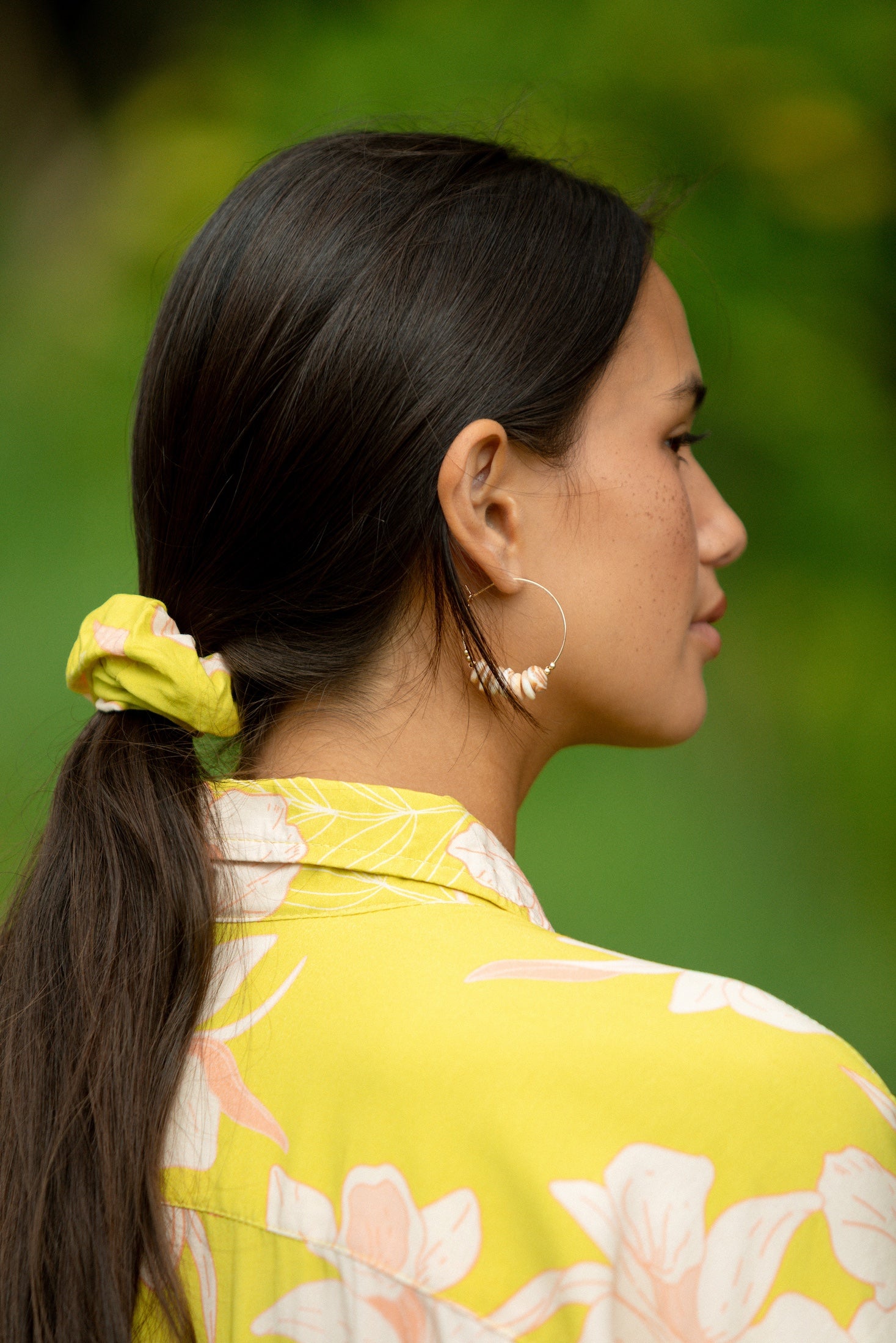 woman wearing scrunchie in bright orchid pattern
