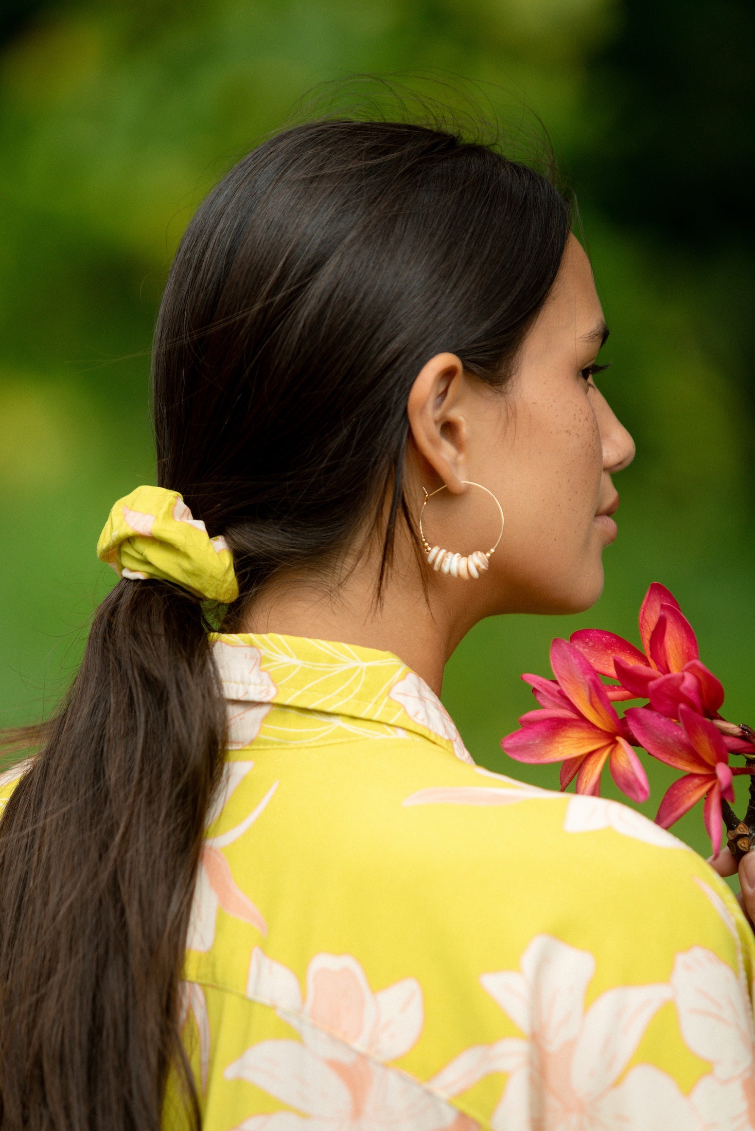 woman wearing scrunchie in bright orchid pattern