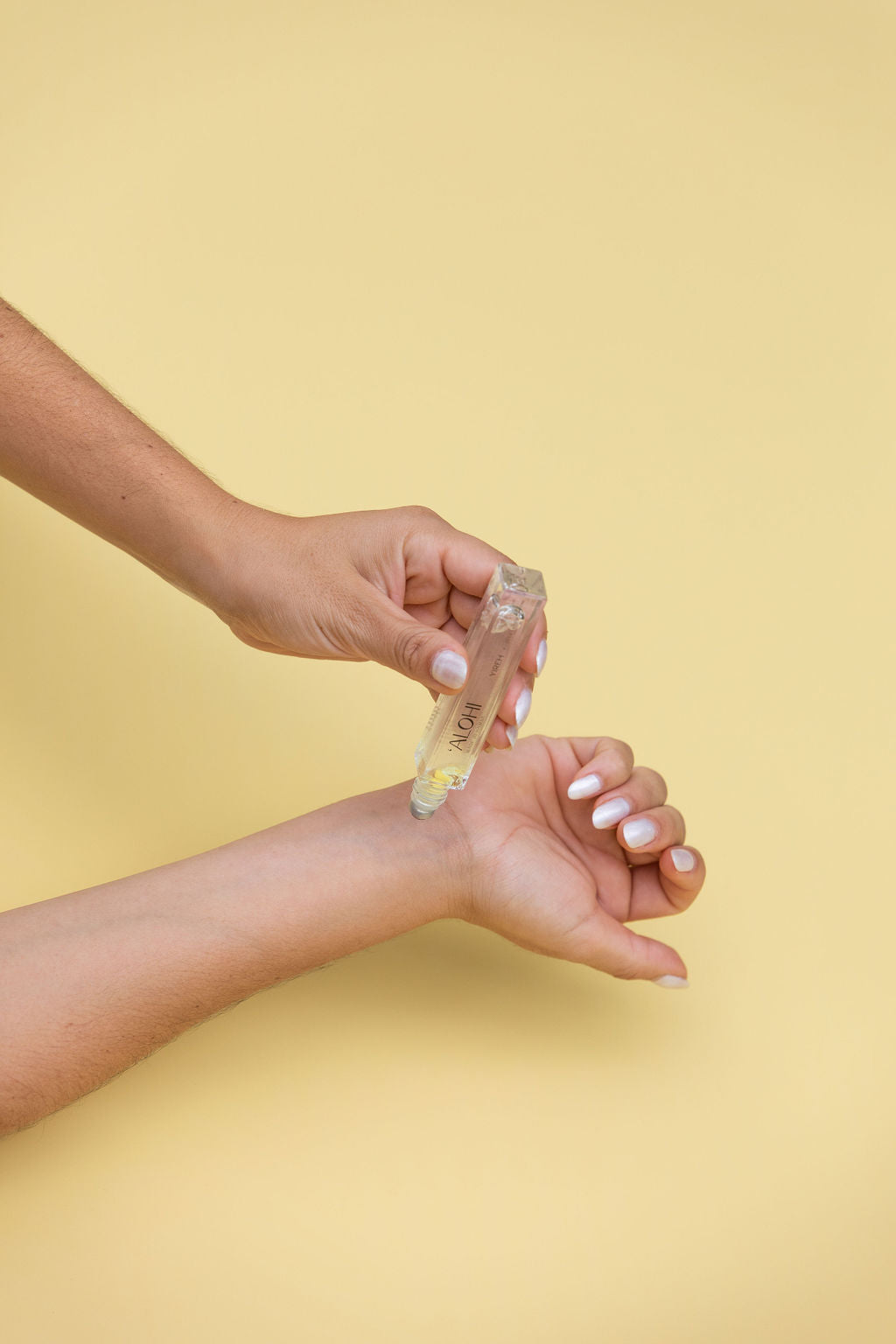 YIREHxJules 'Alohi Reed Roller is a naturally derived fragrance that will uplift your mood, make you feel beautiful + confident, and encourage you to shine your brightest. - Roller being applied to skin