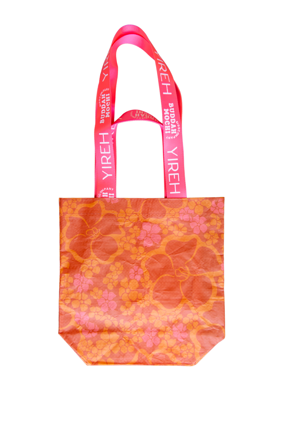 orange buddah mochi manini bag with puakenikeni and bright pink straps. The print is pua pai'ina. 
