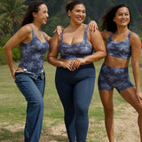 woman wearing a sports bra with blue hibiscus pattern and blue workout legging with pockets