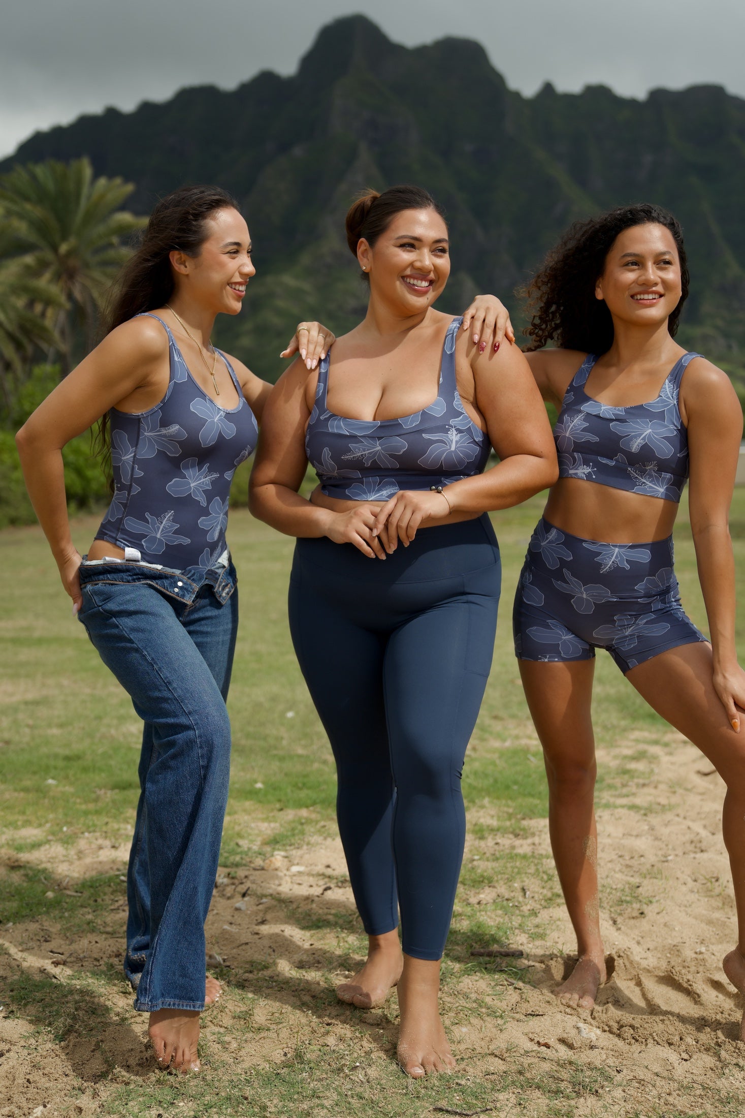 woman wearing a sports bra with blue hibiscus pattern and blue workout legging with pockets