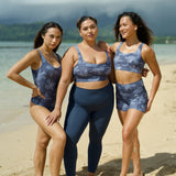 woman wearing a sports bra with blue hibiscus pattern
