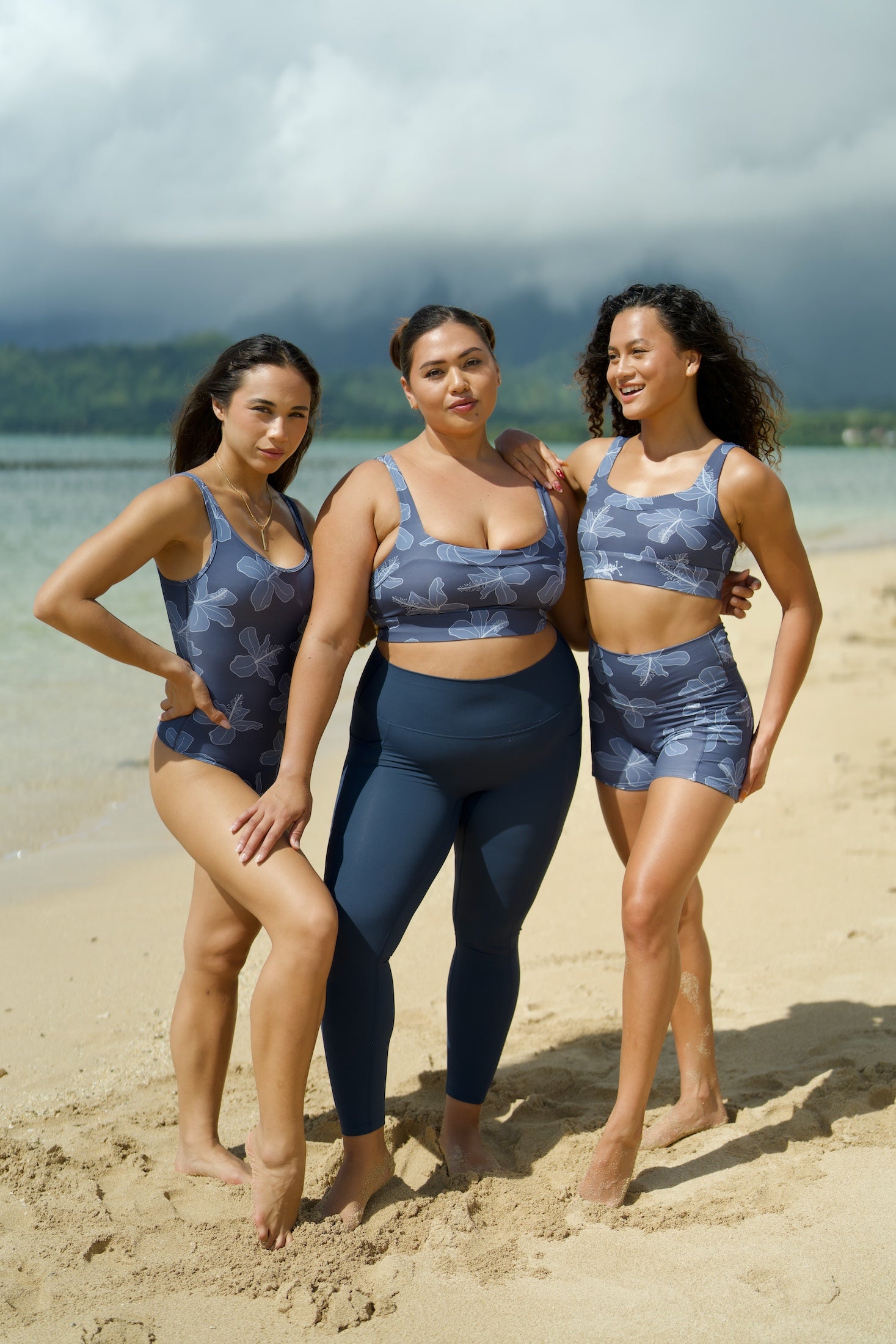 woman wearing a sports bra with blue hibiscus pattern
