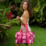 woman carrying wine colored neoprene tote bag with thick straps and detachable pouch with orchid print