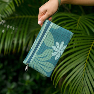 woman carrying canopy green colored neoprene tote bag with thick straps and detachable pouch with naupaka print