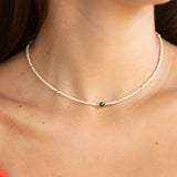 woman wearing a beaded keshi pearl necklace in sand color