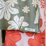 green cotton throw blanket with naupaka print