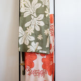 green cotton throw blanket with naupaka print