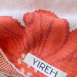 orange cotton throw blanket with floral print