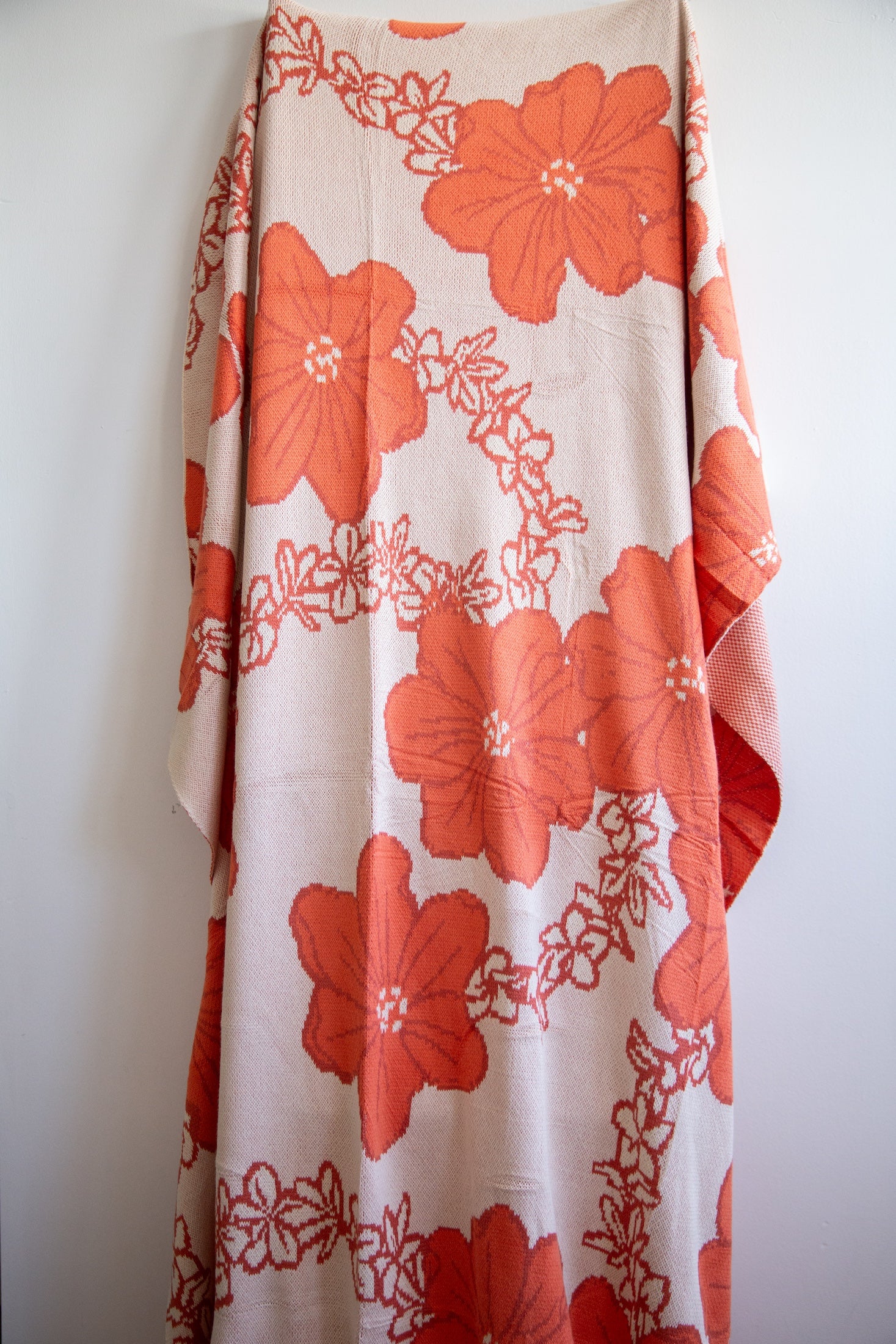 orange cotton throw blanket with floral print