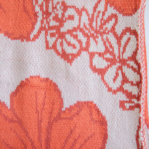 orange cotton throw blanket with floral print