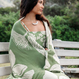 green woven cotton blanket with native hawaiian flowers 