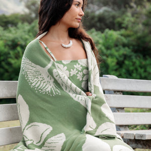 green woven cotton blanket with native hawaiian flowers 