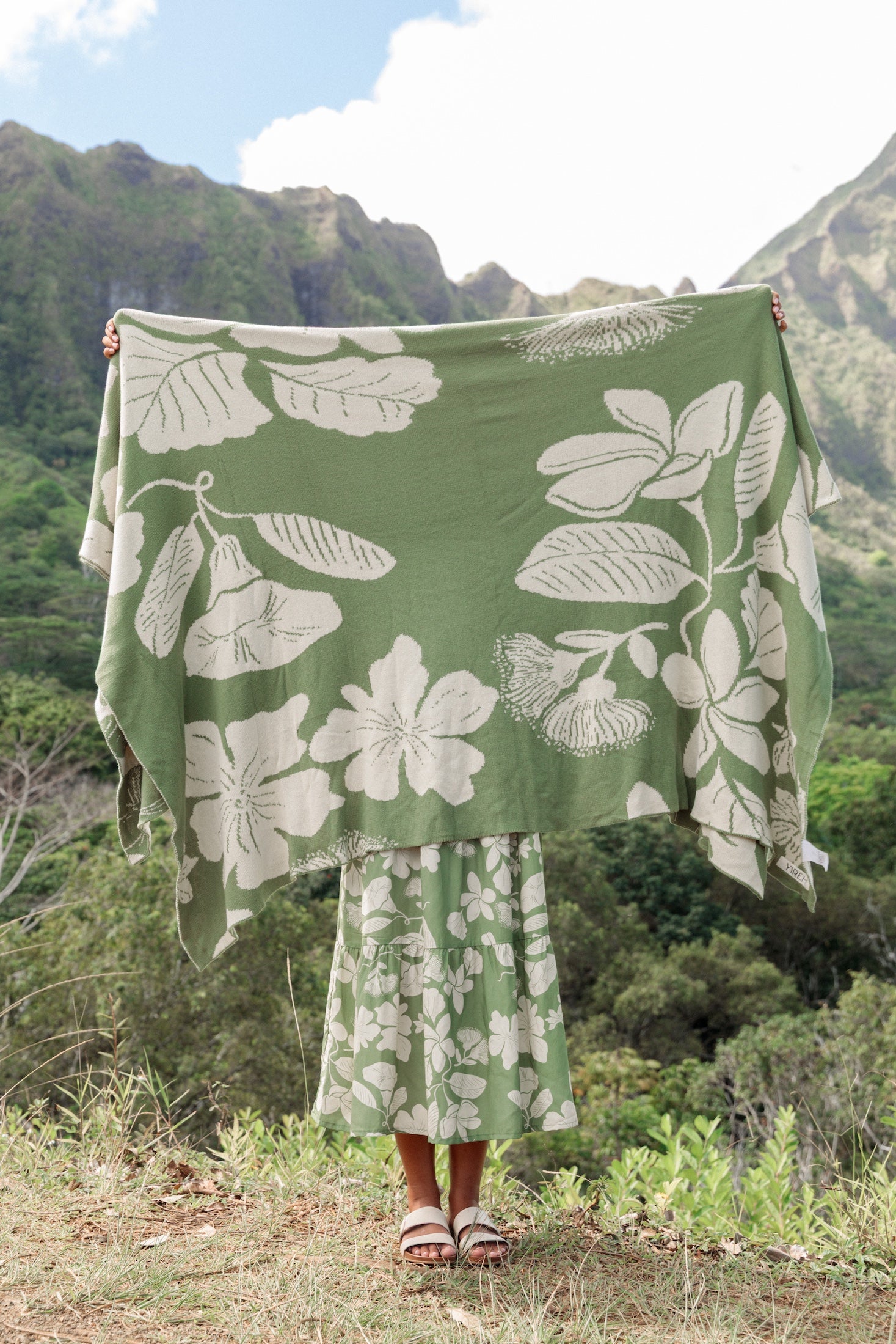 green woven cotton blanket with native hawaiian flowers 