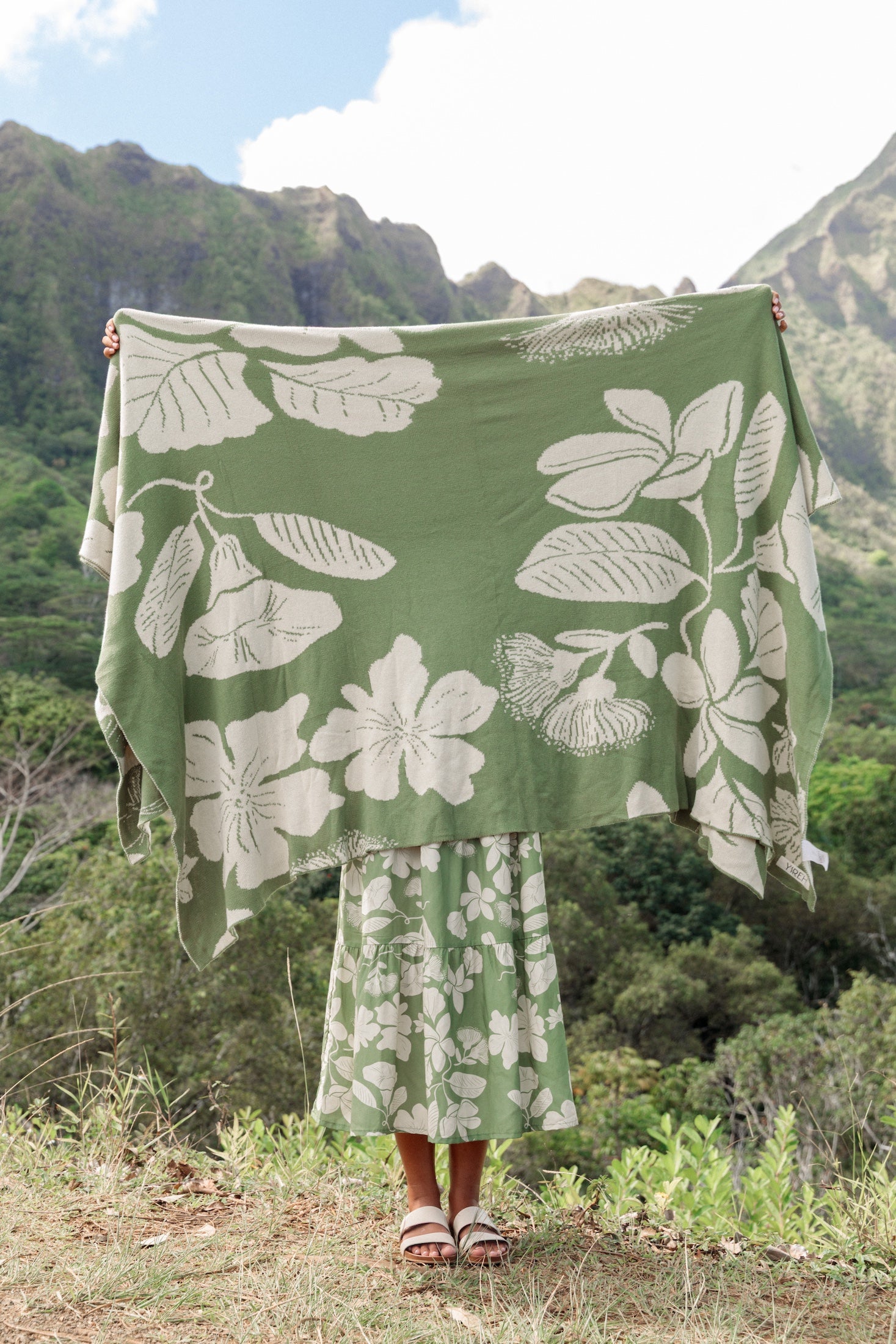 green woven cotton blanket with native hawaiian flowers 