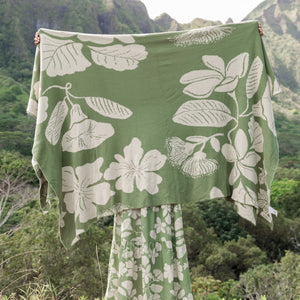 green woven cotton blanket with native hawaiian flowers 