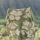 green woven cotton blanket with native hawaiian flowers 