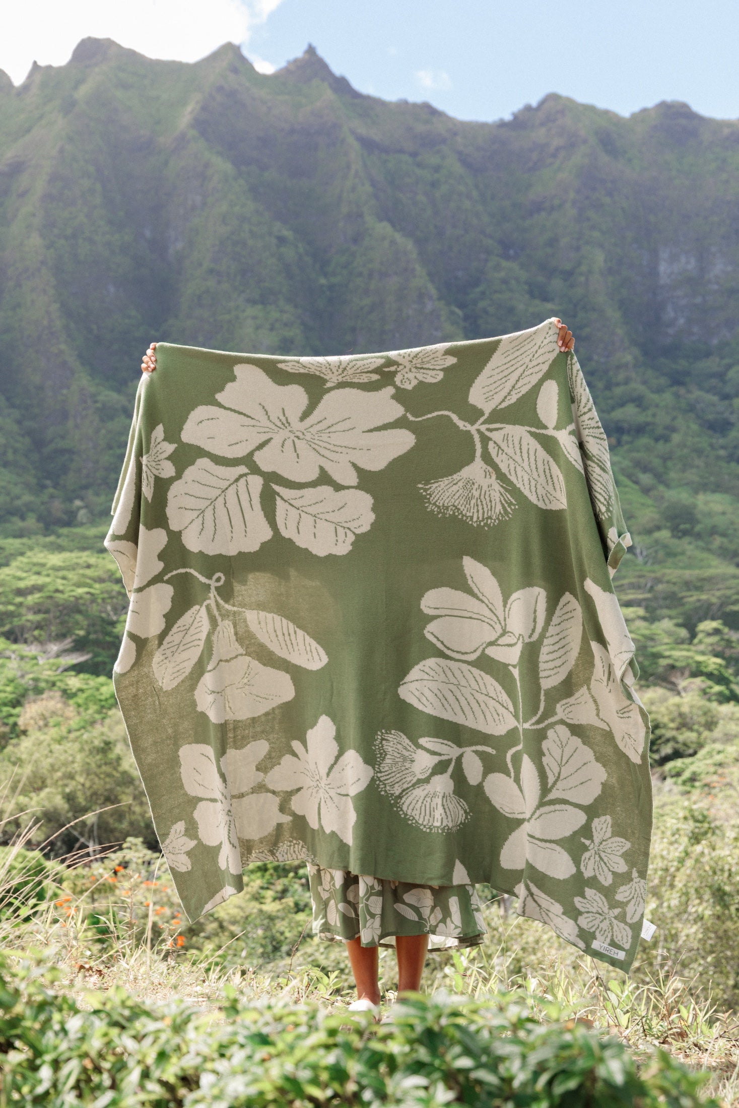 green woven cotton blanket with native hawaiian flowers 