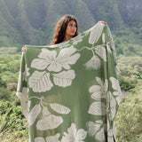 green woven cotton blanket with native hawaiian flowers 