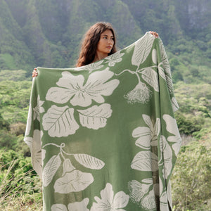 green woven cotton blanket with native hawaiian flowers 