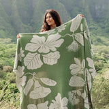 green woven cotton blanket with native hawaiian flowers 