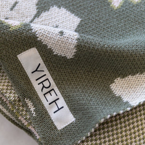 green cotton throw blanket with naupaka print