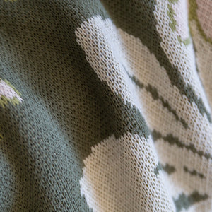 green cotton throw blanket with naupaka print