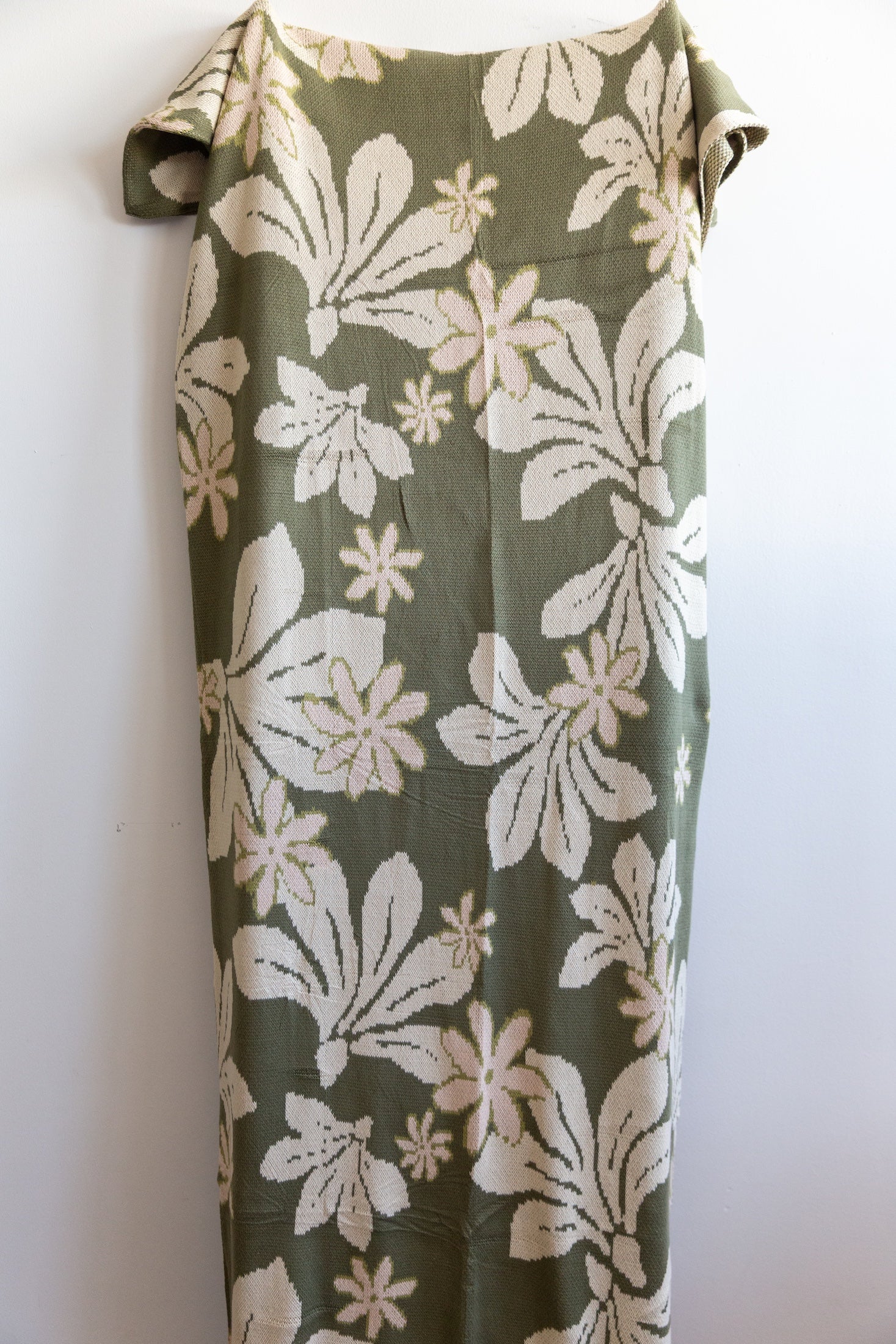 green cotton throw blanket with naupaka print